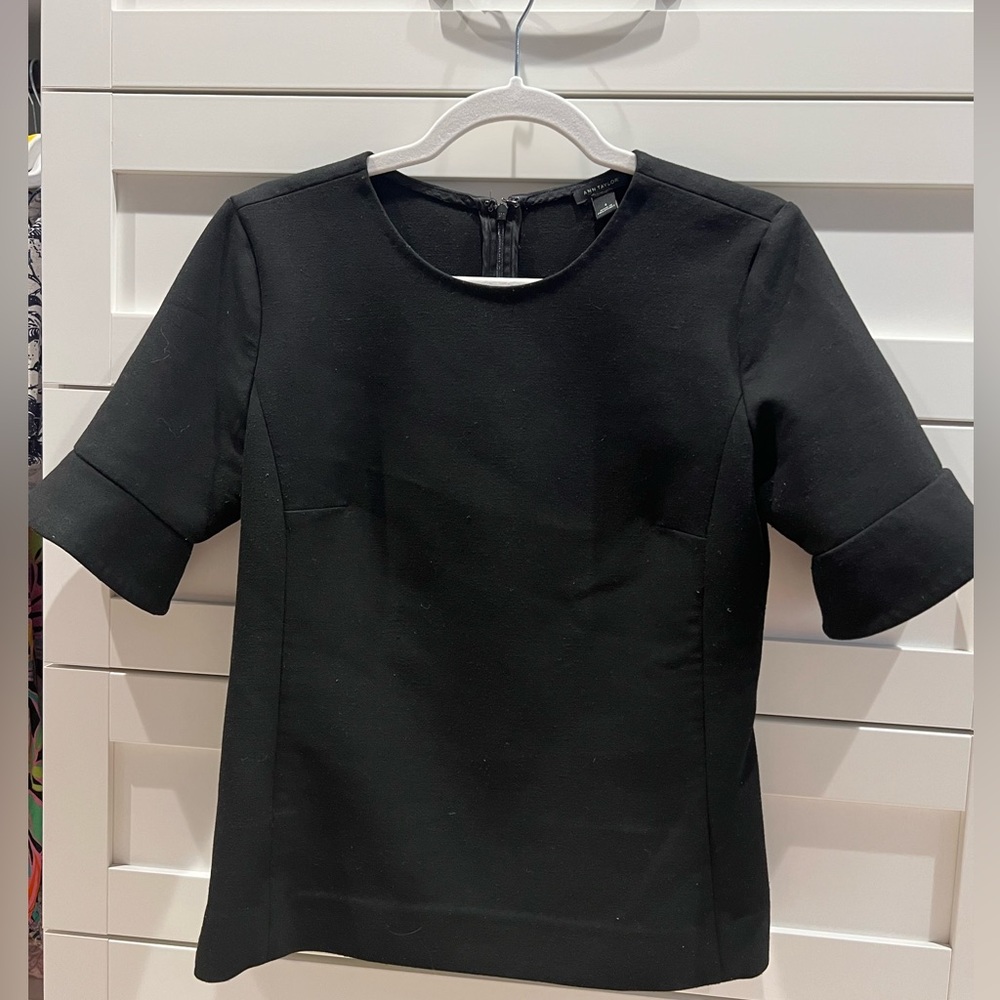 Ann Taylor, black structured top. Zipper down back. Size small